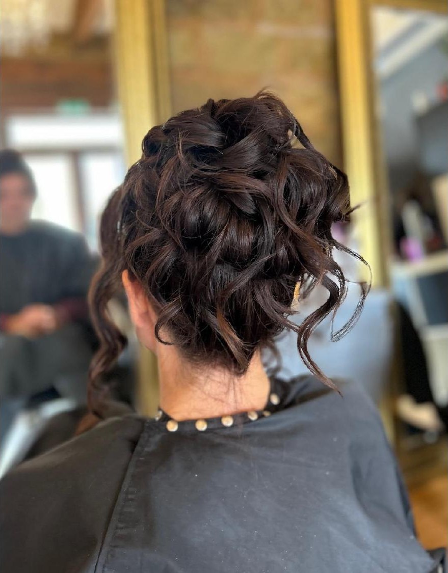 Dark curled occasion upstyle